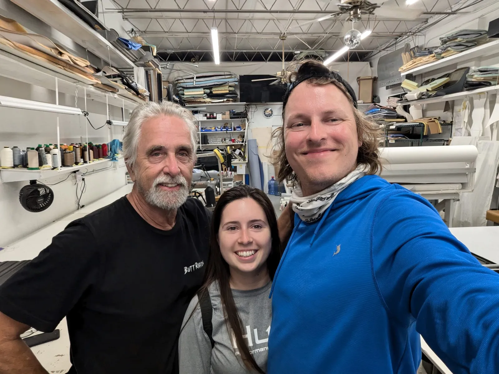 Bobby and Erica of Tech and Mech with a client in his boat seat shop